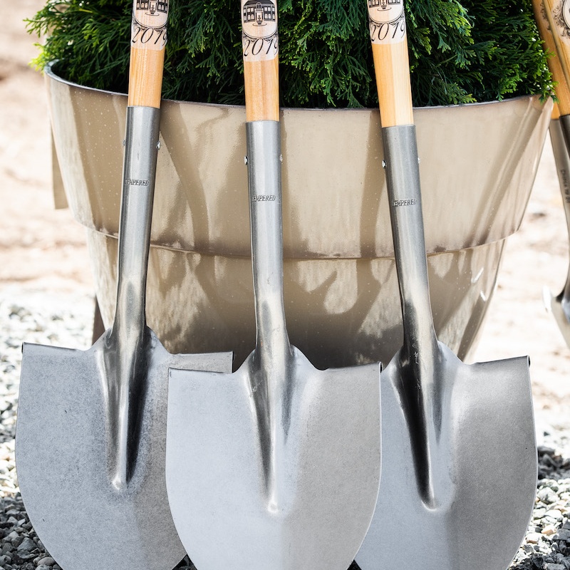 Image show three shovels used in breaking ground on the first of five Villas for senior independent living.